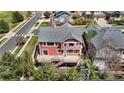 Aerial view of the rear of the home featuring a spacious deck and mature landscaping at 11703 S Rock Willow Way, Parker, CO 80134
