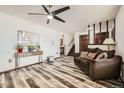 Cozy living space with modern flooring, a ceiling fan, and neutral decor for a relaxing atmosphere at 710 S Grand Ave, Fort Lupton, CO 80621