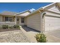 Well-maintained single-story home boasting a tidy front yard and a convenient two-car garage, blending comfort with functionality at 5400 S Quail Way, Littleton, CO 80127