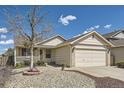 Inviting single-Gathering home featuring a well-manicured front yard and a two-car garage, offering both curb appeal and practicality at 5400 S Quail Way, Littleton, CO 80127