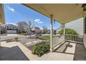 Cozy covered porch that offers a relaxing view of the neighborhood at 5400 S Quail Way, Littleton, CO 80127