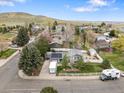 Expansive aerial shot of a charming home nestled in a lush, green neighborhood at 19093 W 61St Pl, Golden, CO 80403