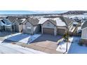 Charming home with a three-car garage, complemented by a driveway showcasing ample parking, nestled in a picturesque neighborhood at 6066 Leilani Dr, Castle Rock, CO 80108