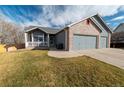Charming single-Gathering home with a well-manicured lawn and cozy front porch, perfect for relaxation at 5283 E 131St Dr, Thornton, CO 80241