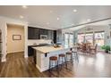 Modern kitchen with stainless steel appliances, dark cabinets, and a spacious island at 286 Western Sky Cir, Longmont, CO 80501