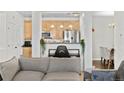 Cozy living space showcasing an open layout with a view to the kitchen at 4100 Albion St # 314, Denver, CO 80216