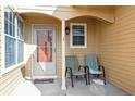 Inviting front porch featuring a cozy seating area perfect for relaxing outdoors at 10349 W Fair Ave # B, Littleton, CO 80127