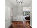 Inviting entryway with hardwood floors leading into the living room filled with natural light at 20125 Indi Dr, Monument, CO 80132