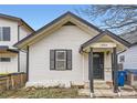 Charming home featuring an inviting front porch and classic architectural details at 2886 S Acoma St, Englewood, CO 80110