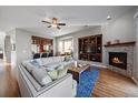 Spacious living room with fireplace and built-in shelving at 10366 Bluffmont Dr, Lone Tree, CO 80124