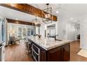 Spacious kitchen with a large island, stainless steel appliances, and hardwood floors at 2805 E 4Th Ave, Denver, CO 80206