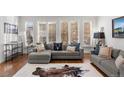 Spacious living room featuring comfortable seating and large windows at 2805 E 4Th Ave, Denver, CO 80206