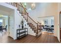 Elegant foyer with a staircase, hardwood floors, and views into the living spaces at 4240 S Yukon Way, Lakewood, CO 80235