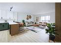 Open floor plan showcasing kitchen, dining area, and living room with modern decor at 3450 S Poplar St # 307, Denver, CO 80224