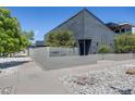 Contemporary home featuring modern architectural design, secure fencing, and landscaped surroundings at 2801 Lawrence St, Denver, CO 80205