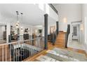 Open floor plan with hardwood floors and a modern staircase at 967 Country Club Pkwy, Castle Rock, CO 80108