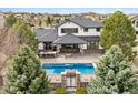 Aerial view showcasing the in-ground pool, patio, and outdoor kitchen area, perfect for entertaining at 5375 Twilight Way, Parker, CO 80134