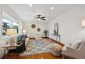 Open living room with hardwood floors, contemporary furnishings, and an inviting atmosphere, ideal for gatherings at 4634 S Adobe Ct, Littleton, CO 80127