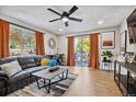 Inviting living area with neutral walls, balcony access, and space for work and relaxation at 7755 E Quincy # 201, Denver, CO 80237