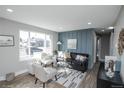 Bright living room with large window, stylish decor, and an open layout perfect for entertaining at 4933 W 61St Ave, Arvada, CO 80003