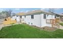 Charming white brick home with a well-maintained lawn and inviting front porch at 2295 S Sherman St, Denver, CO 80210