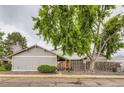 Charming home with mature trees, fenced yard, and inviting entrance at 10295 E Evans Ave # 114, Aurora, CO 80247