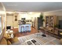 Bright open layout showcasing a modern kitchen and dining area with stylish furnishings and stainless steel appliances at 9300 E Center Ave # 6A, Denver, CO 80247