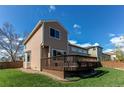 Spacious backyard with a wooden deck, perfect for outdoor entertaining at 495 Bexley St, Highlands Ranch, CO 80126