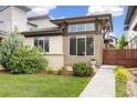 Modern home featuring a well-manicured lawn and a unique architectural design with ample natural light at 1340 W 68Th Ave, Denver, CO 80221