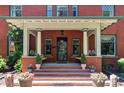 Charming covered porch with ample space for seating and potted flowers at 1275 N Franklin St, Denver, CO 80218
