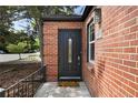 Close up of front entry featuring an ornate door with glass insert and a welcoming front porch at 1111 Kearney St, Denver, CO 80220