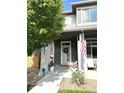 Inviting front entrance with a wreath on the door and an American flag waving at 6834 Clay N St, Denver, CO 80221