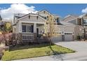 Attractive two-story home with a three-car garage, covered porch, and lush landscaping at 2208 Bellavista St, Castle Rock, CO 80109