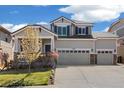 Inviting two-story home with a covered porch, three-car garage, and a well-maintained lawn at 2208 Bellavista St, Castle Rock, CO 80109