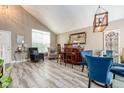 Open dining area with a bar, comfortable seating, and elegant decorative accents at 22160 Wintergreen Way, Parker, CO 80138