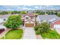 Charming two-story home with a well-maintained lawn and a two-car garage at 22160 Wintergreen Way, Parker, CO 80138