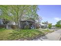 A charming home with a well-kept lawn and mature trees at 833 Osceola St, Denver, CO 80204