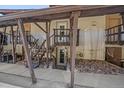 Unique home featuring a welcoming entrance with wooden stairs, rock landscaping, and a charming exterior at 80 Clear Creek Ln # 10, Golden, CO 80403