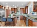 Well-equipped kitchen boasting a center island, stainless steel appliances, and modern cabinetry at 920 Neon Forest Cir, Longmont, CO 80504