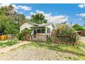 Charming single-story home with a picket fence, garden, and well-maintained landscaping at 3625 W 9Th Ave, Denver, CO 80204
