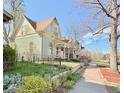 Inviting street view showcasing the charming facade of the home, complemented by a well-maintained lawn and garden at 3337 Decatur St, Denver, CO 80211