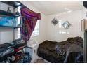 Bright bedroom with a cozy feel, featuring neutral walls, natural light, and a comfortable bed at 358 S Osceola St, Denver, CO 80219