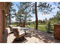 Relaxing deck area offering scenic views of the golf course and surrounding landscape at 120 Silver Leaf Way, Castle Rock, CO 80108