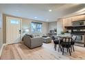 Inviting living area with hardwood floors, comfortable seating, and plenty of natural light at 120 S Pennsylvania St # 207, Denver, CO 80209