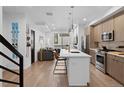 Modern kitchen with stainless steel appliances, white countertops, hardwood flooring, and pendant lighting at 1930 Hooker St # 3, Denver, CO 80204