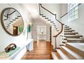 Elegant entry with hardwood floors and a grand staircase at 869 Vine St, Denver, CO 80206
