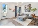 Bright living room with modern furnishings and an interesting art collection on display at 3550 W 63Rd Ave, Denver, CO 80221