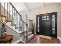 Bright entryway with staircase and hardwood floors at 6269 S Coventry E Ln, Littleton, CO 80123