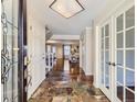 Welcoming foyer with tiled entry, leading into the open-concept living spaces at 6194 E Briarwood Cir, Centennial, CO 80112