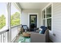 Inviting front porch with cozy seating, ideal for relaxing and enjoying the outdoors in comfort and style at 10069 E 28Th Ave, Denver, CO 80238